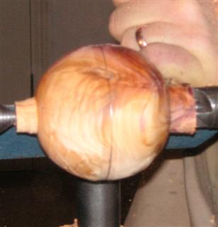 Turning the yew sphere roughly to shape